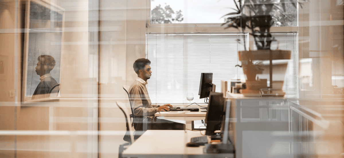 Employee at desk computer screen
