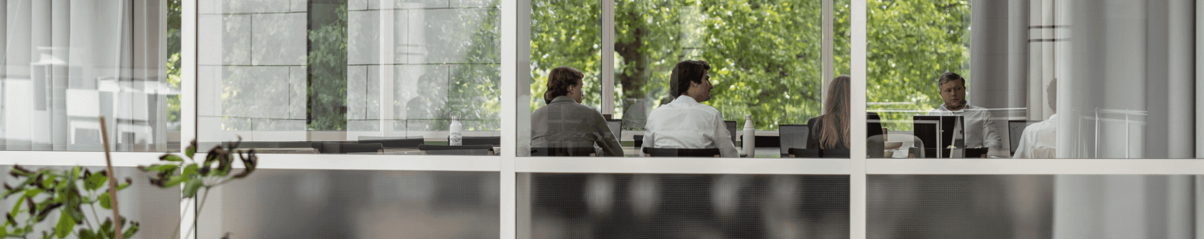 Meeting room with large windows and green view