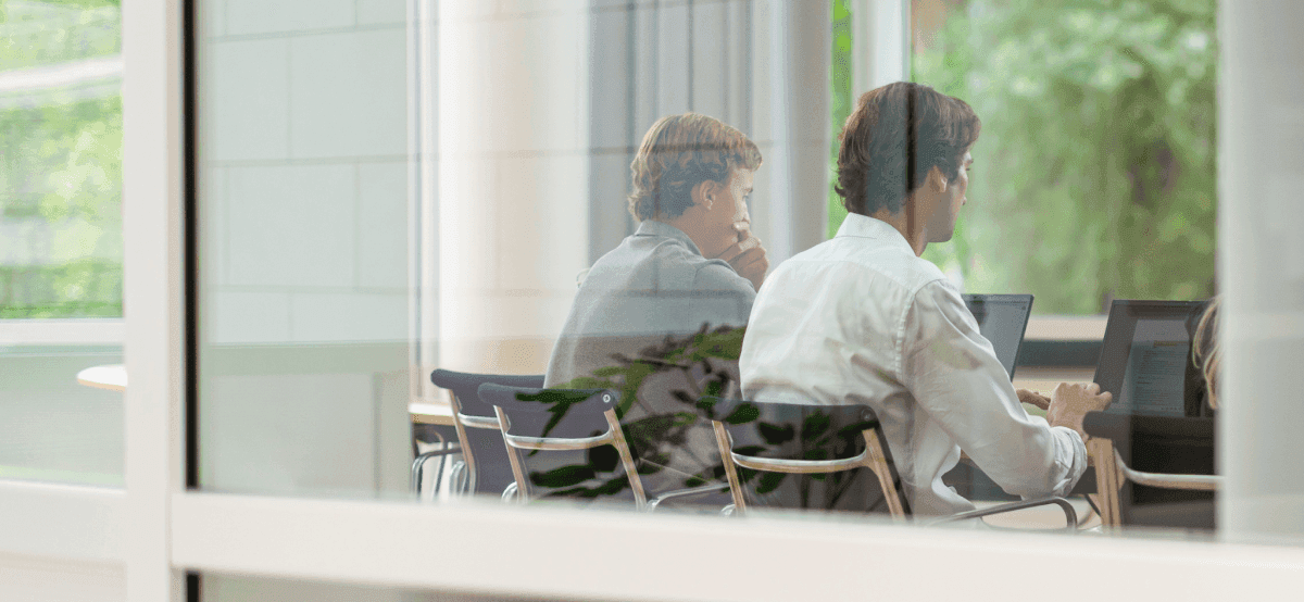 Meeting seen through glass wall